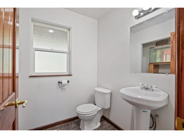 a view of hallway with stairs and furniture