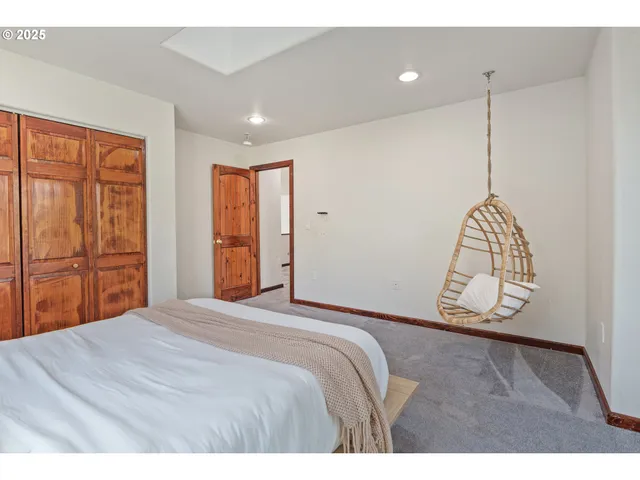 a bathroom with a toilet a sink and a mirror