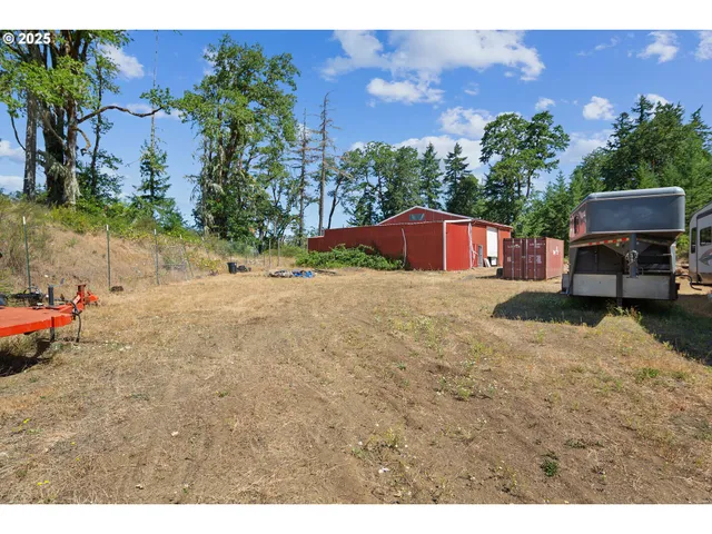 a view of a city with lush green forest