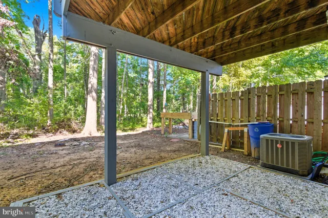 a view of a porch with furniture and yard