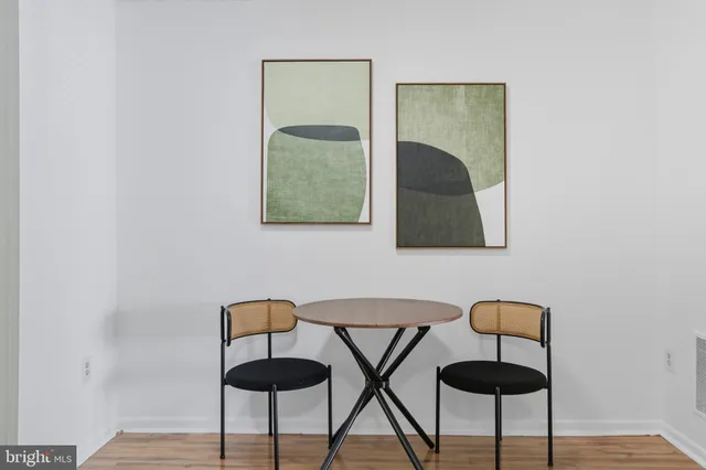 a lamp on a table and a potted plant sitting on a table