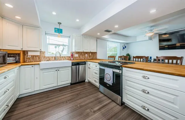 a bedroom with a bed mirror and window