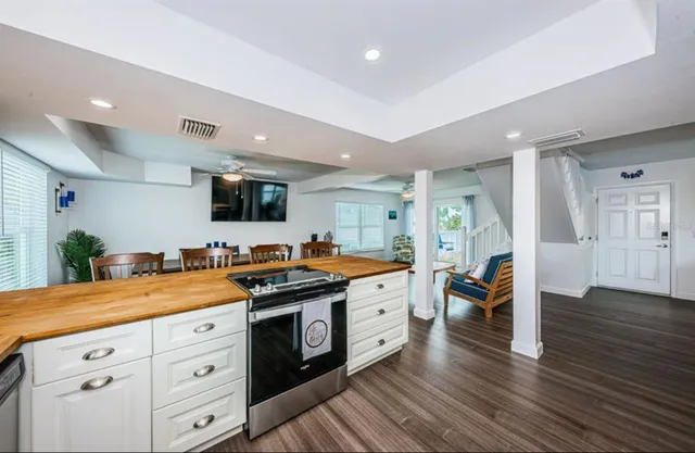 a bathroom with a double vanity sink toilet and shower