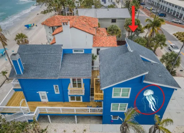 a view of a house with wooden deck