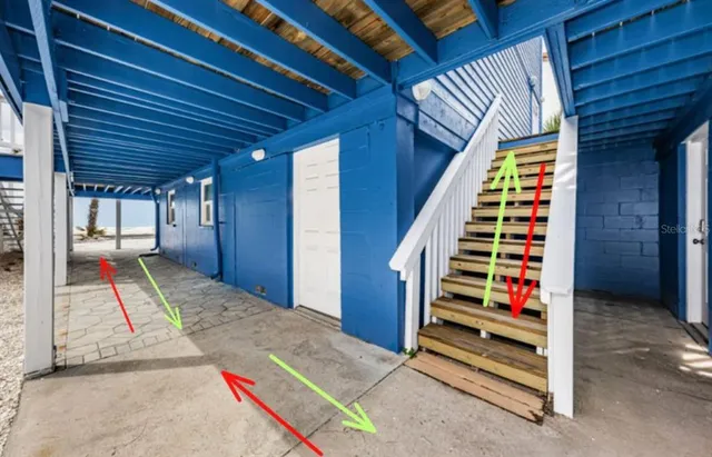 a living room with furniture ceiling fan and a rug