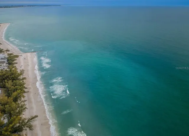 a kitchen with granite countertop a sink stainless steel appliances and cabinets