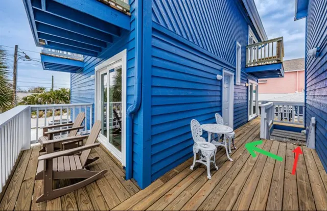 a kitchen with refrigerator and cabinets