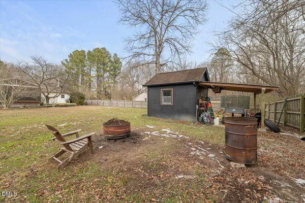 a backyard of a house with seating space