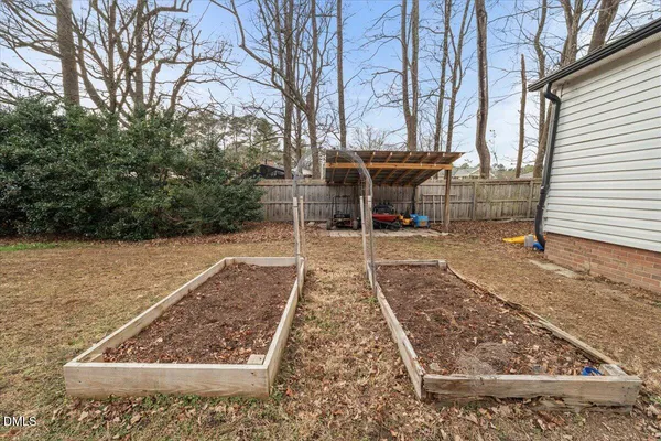 a view of a backyard with sitting area