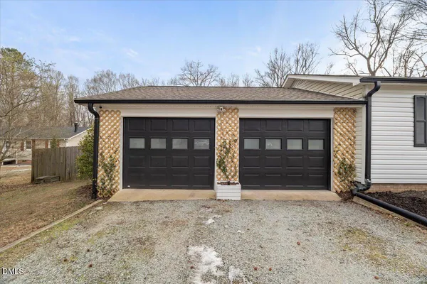 a view of a house with a space and parking space