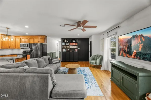 a living room with furniture and a flat screen tv