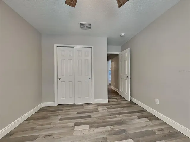 a view of a livingroom with wooden floor
