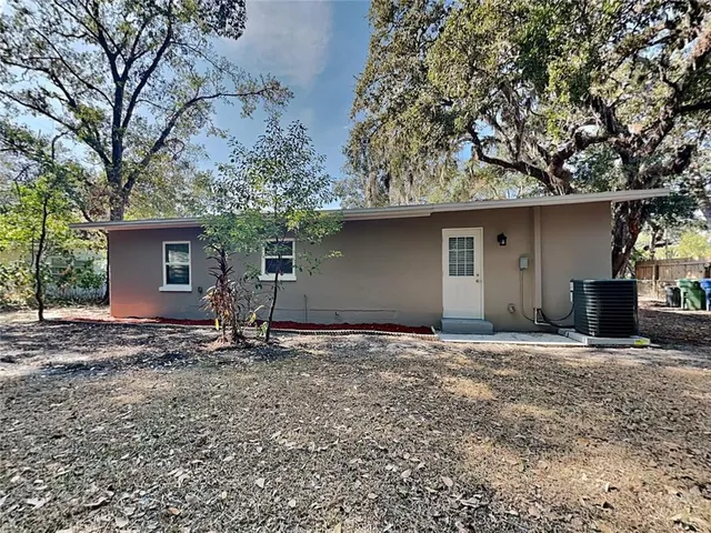 a house with trees in the background