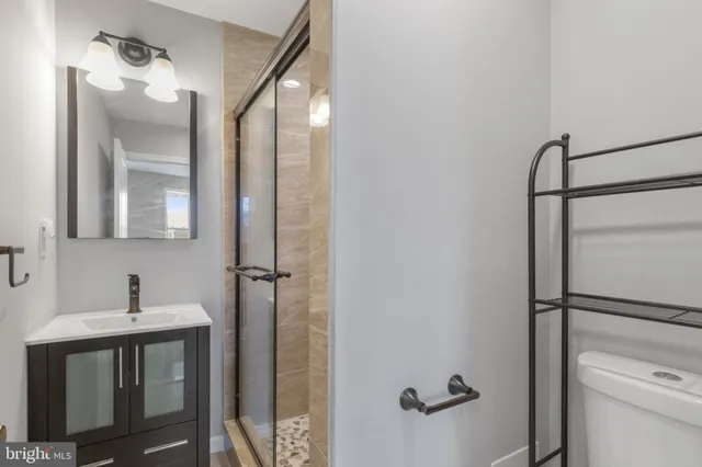 a bathroom with a sink and mirror