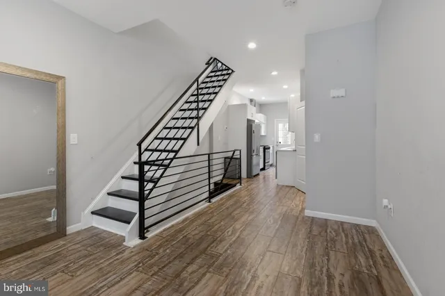 a view of entryway with wooden floor