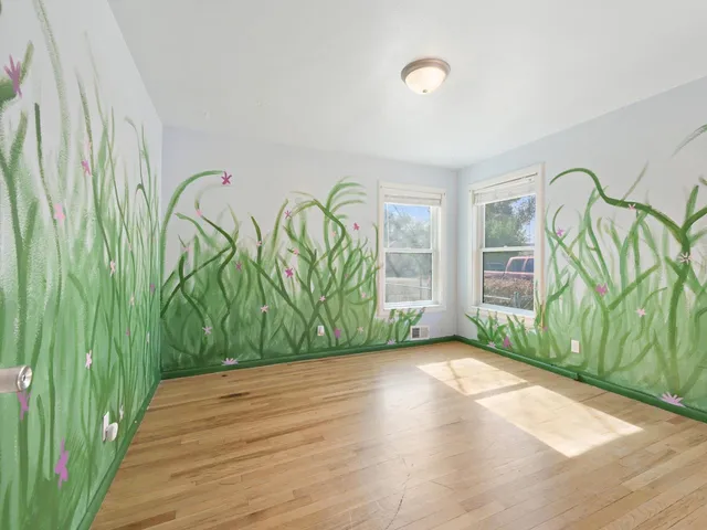 a view of an entryway with wooden floor