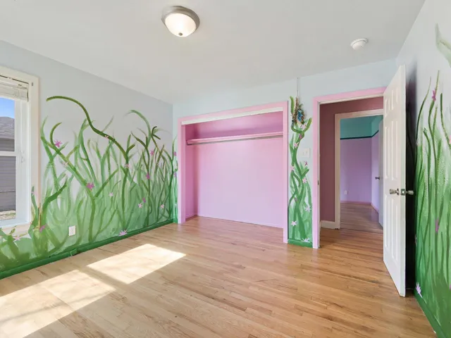 a bathroom with a sink vanity mirror and toilet