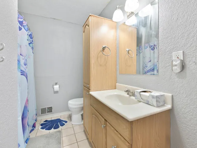 an empty room with a empty space and windows