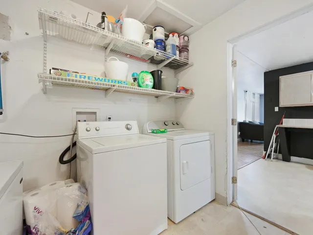 a living room with furniture and flat screen tv