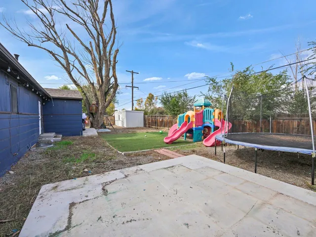 a view of a house with a tree