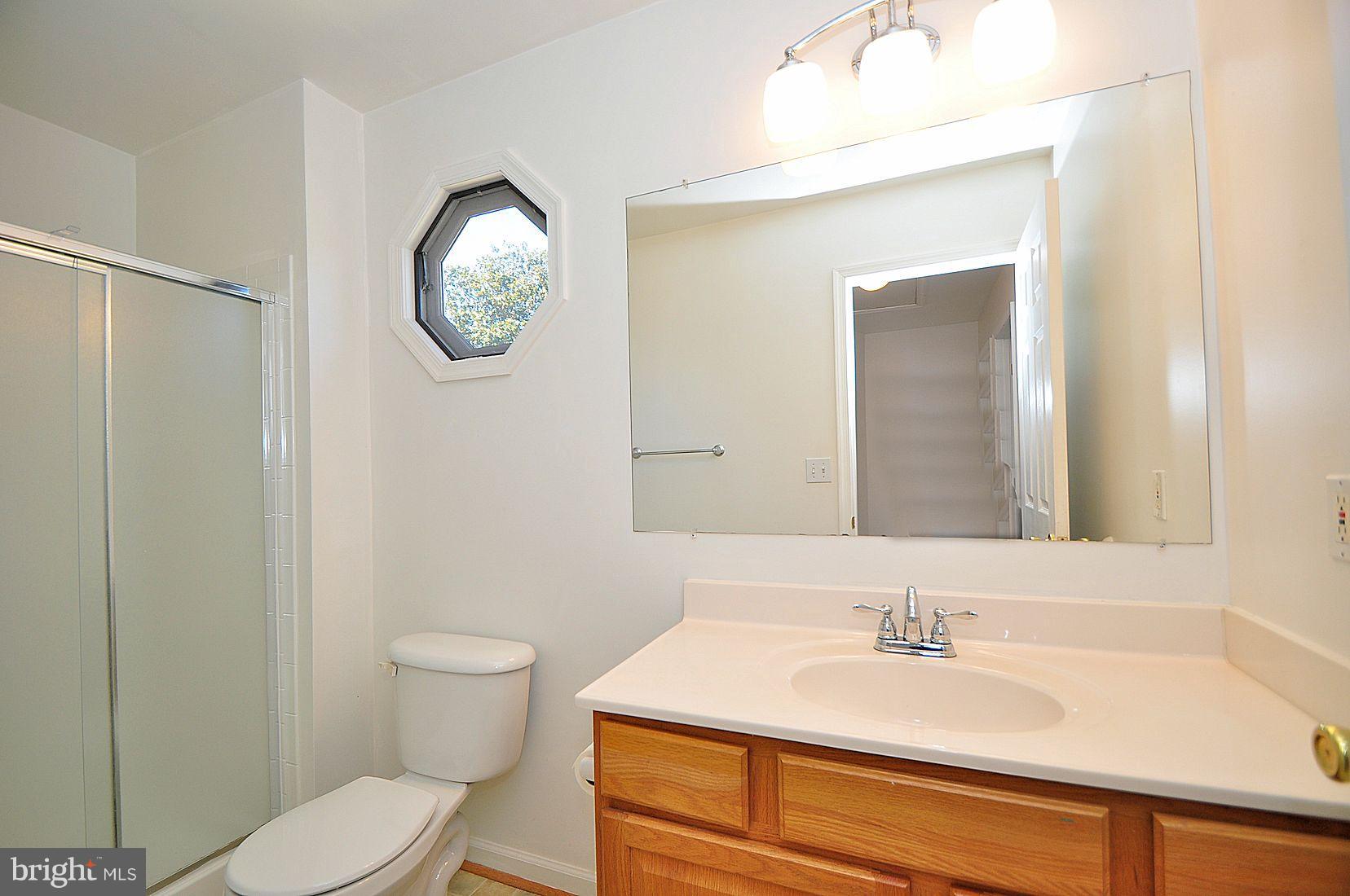 8445 Garland Road Pasadena, MD 21122 - Photo 25 of 30 Upper Level Hall Bath
