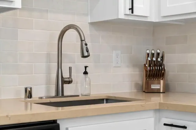 a close view of sink and mirror