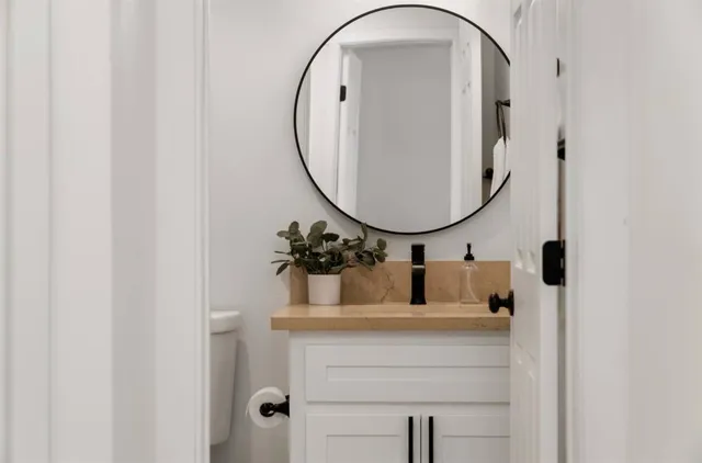 a bathroom with a sink and a mirror