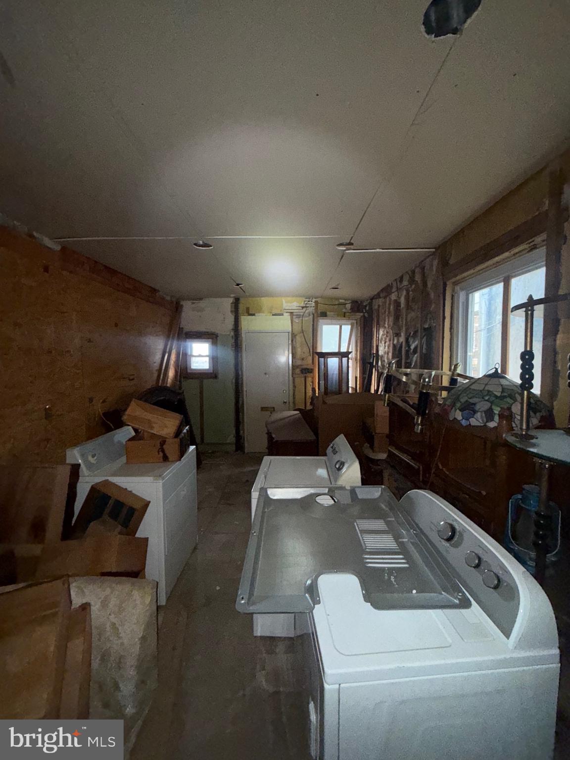 1467 North 60th Street Philadelphia, PA 19151 - Photo 4 of 23 a living room with couches and kitchen view with wooden floor