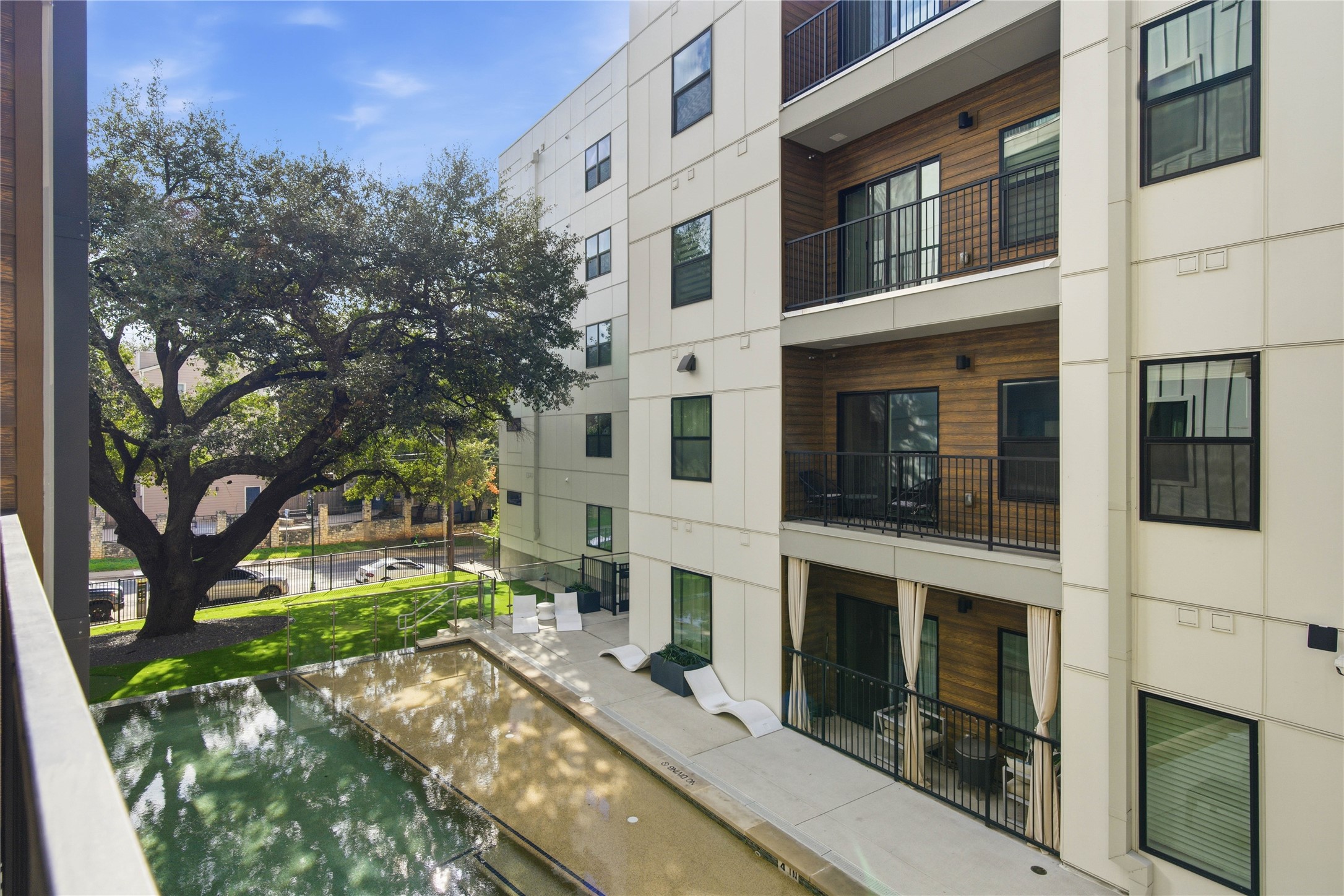 2500 Longview Street, Unit 219 Austin, TX 78705 - Photo 13 of 40 a view of a building with a tree in front of it