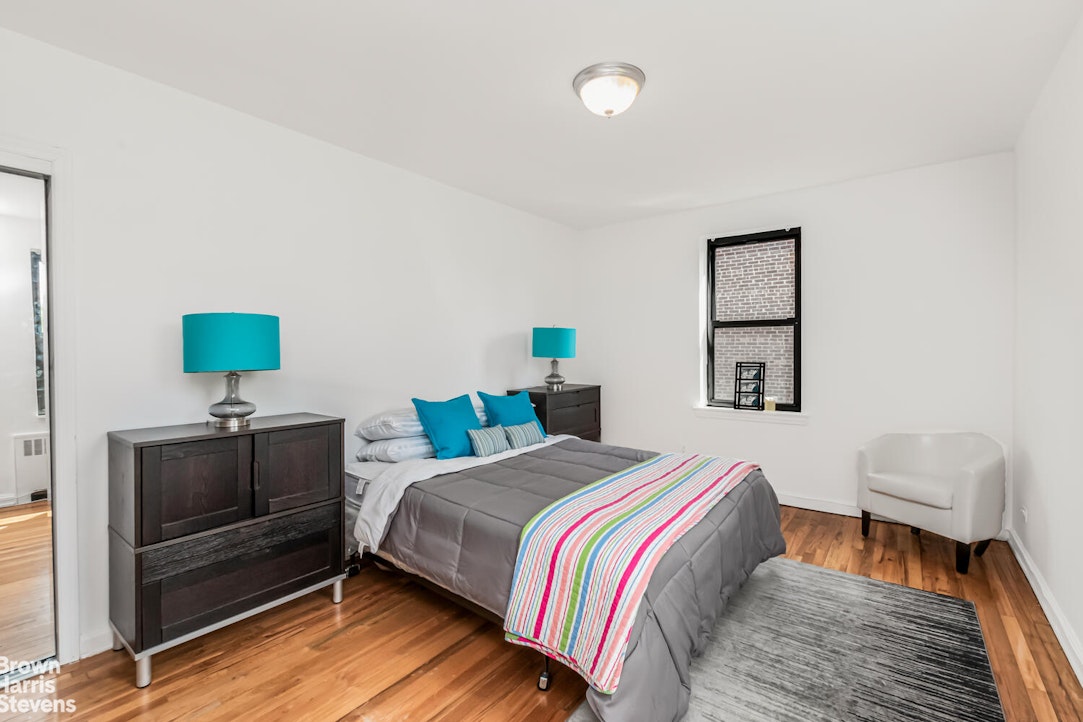 3840 Greystone Avenue, Unit 5L Bronx, NY 10463 - Photo 11 of 41 a bedroom with a bed and a couch