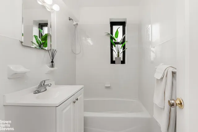 a view of a workspace with wooden floor