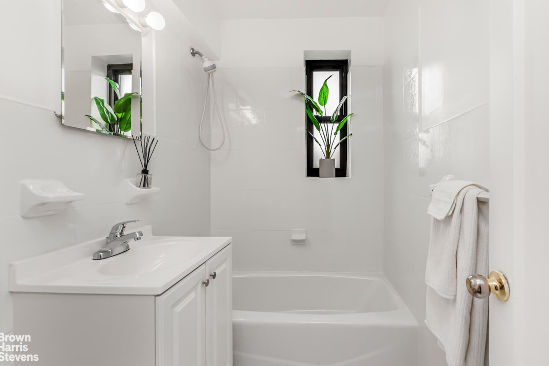 3840 Greystone Avenue, Unit 5L Bronx, NY 10463 - Photo 14 of 41 a bathroom with a sink a toilet and shower