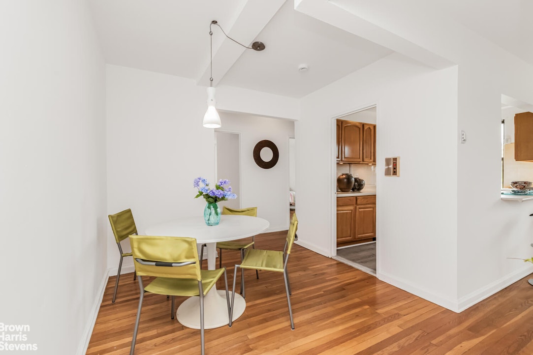 3840 Greystone Avenue, Unit 5L Bronx, NY 10463 - Photo 7 of 41 a view of a dining room with furniture and wooden floor