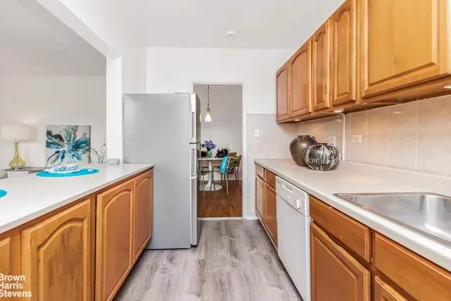 a kitchen with sink cabinets and window