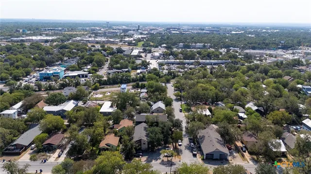 an aerial view of a city with lots of residential buildings