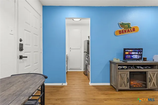 a view of kitchen with furniture and a fireplace