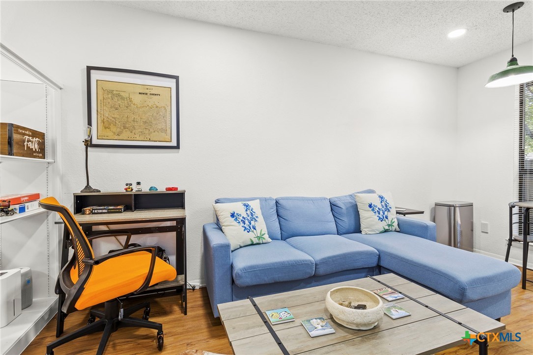 4701 Red River Street, Unit 102 Austin, TX 78751 - Photo 4 of 20 a living room with furniture and a window
