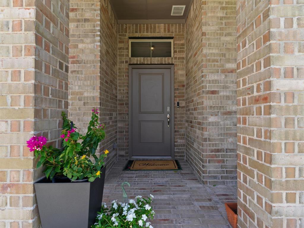 270 Lunayena Road Rhome, TX 76078 - Photo 3 of 37 A welcoming entryway creates a warm first impression, offering a functional transition into the home's open living spaces with easy access to the main gathering areas.