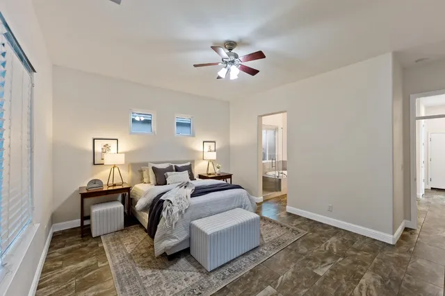 a bed room with a bed and a chandelier