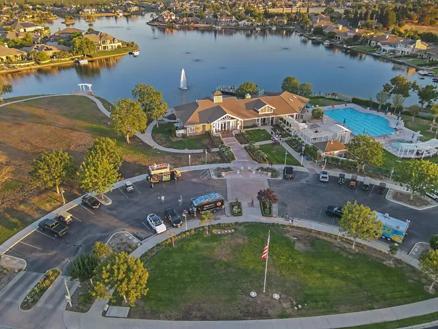 an aerial view of a house with a lake view