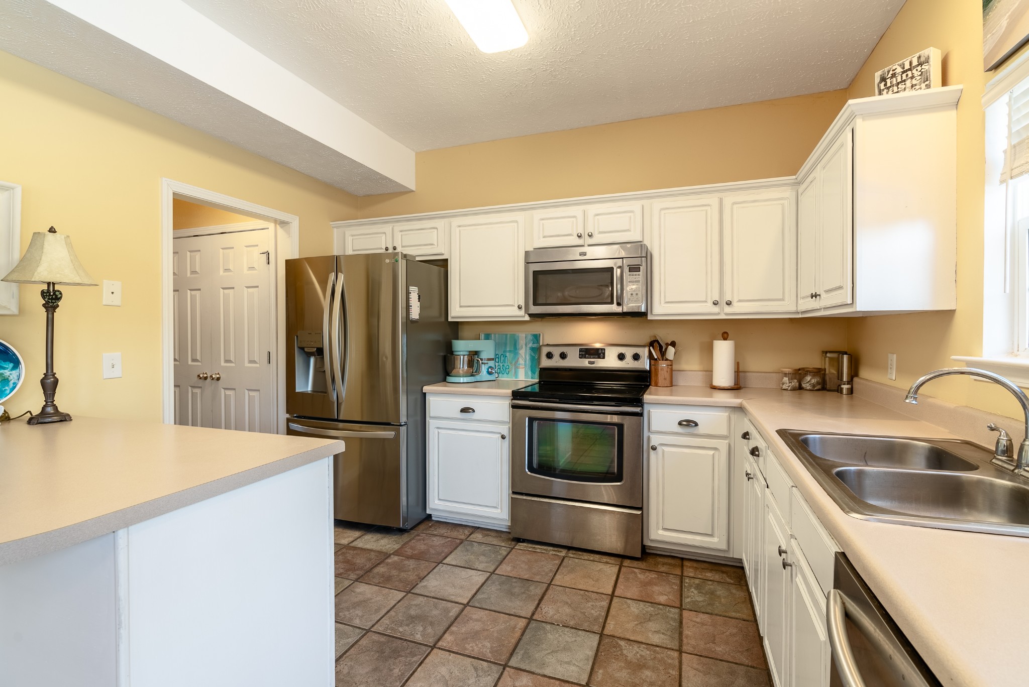 1707 Ginger Way Spring Hill, TN 37174 - Photo 15 of 39 a kitchen with a sink appliances and cabinets