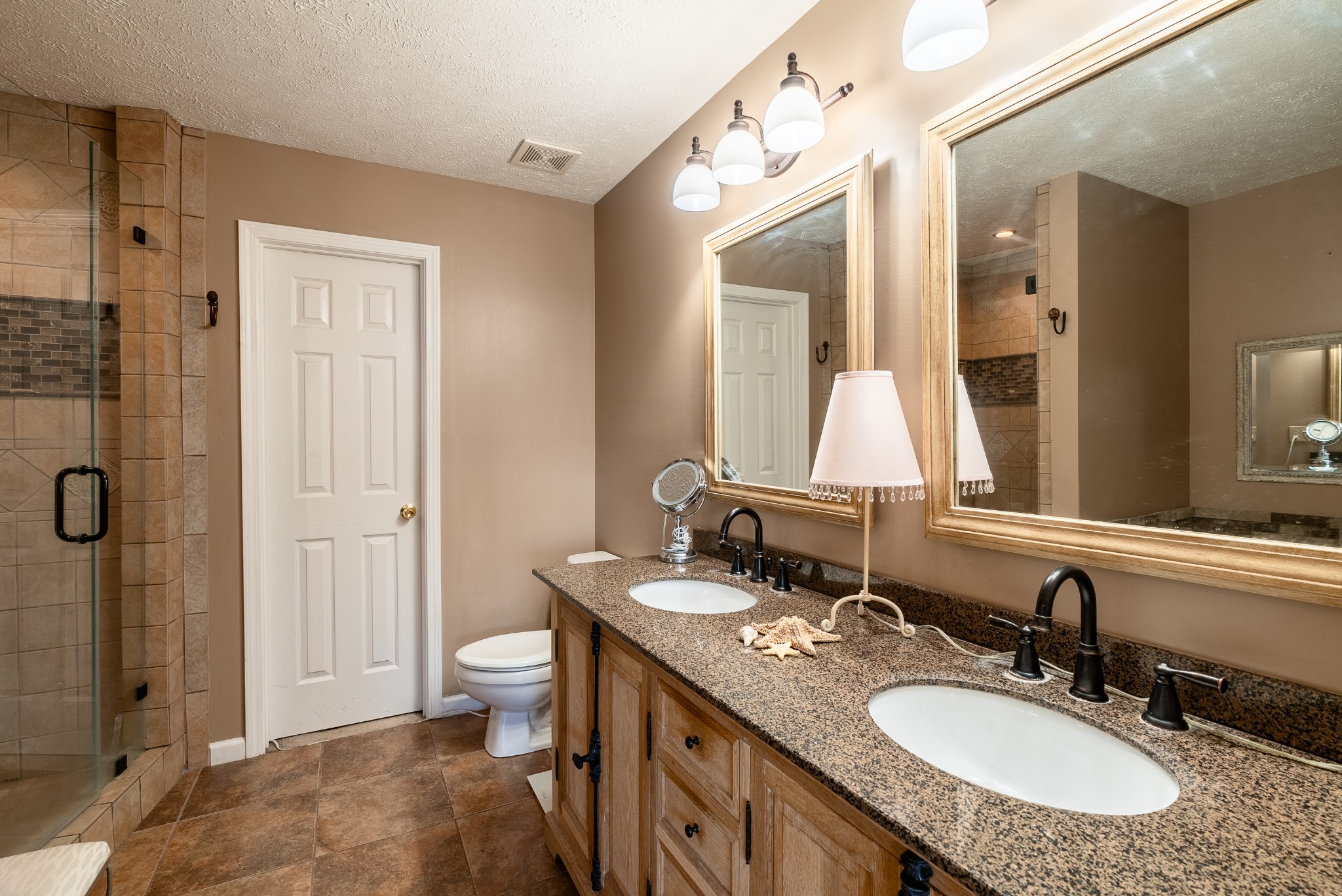 1707 Ginger Way Spring Hill, TN 37174 - Photo 22 of 39 a bathroom with a sink double vanity and a toilet