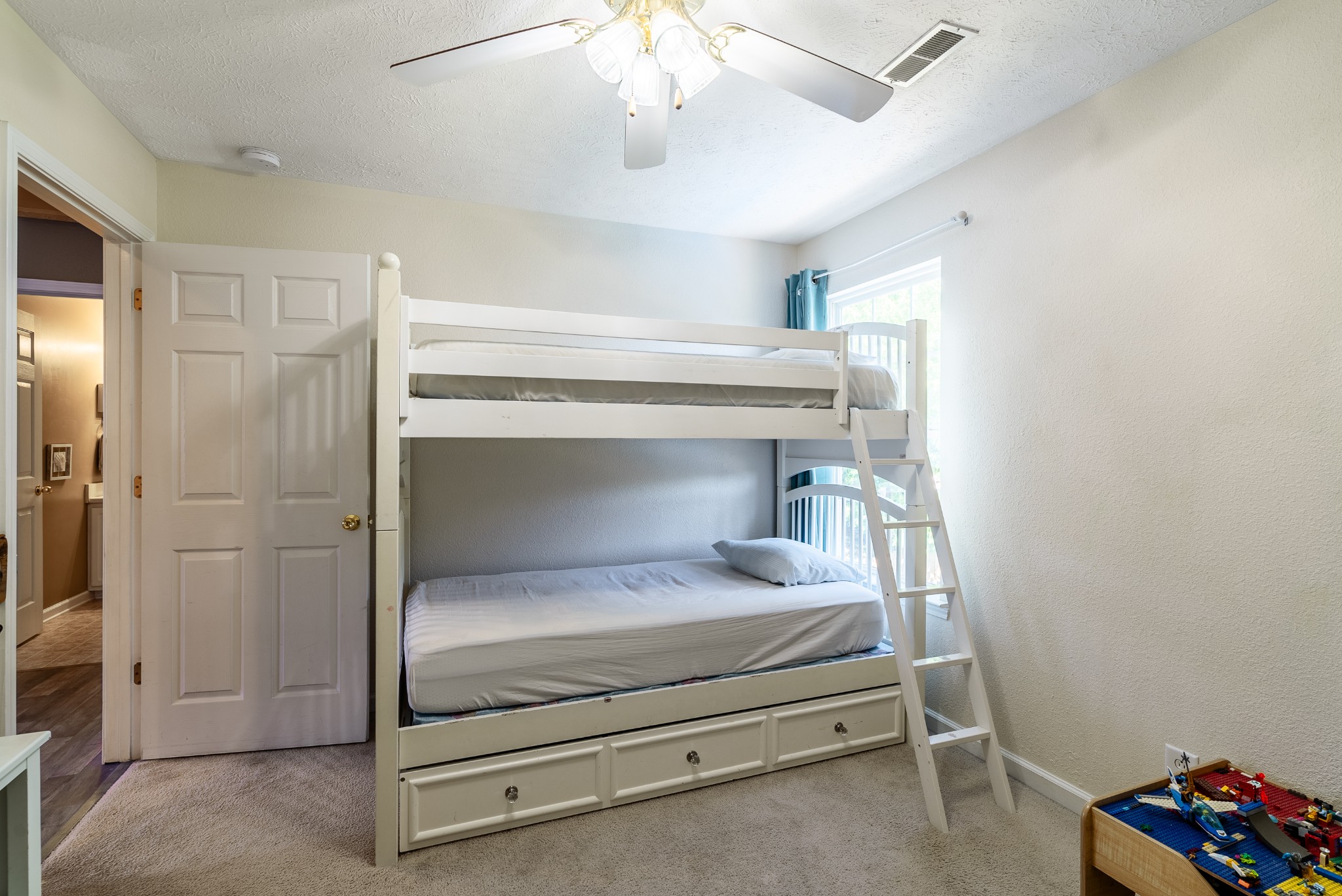 1707 Ginger Way Spring Hill, TN 37174 - Photo 25 of 39 a bedroom with a bed and a chandelier