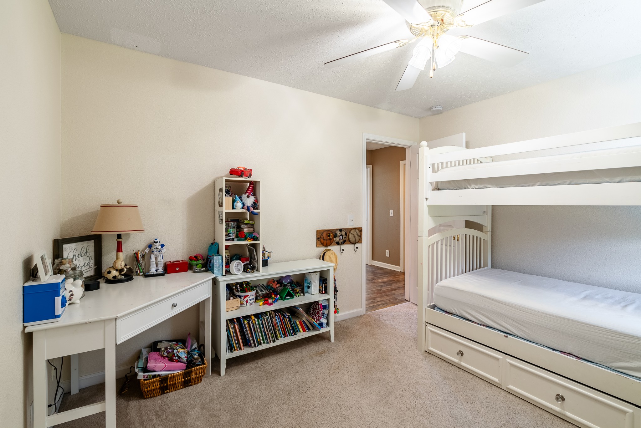 1707 Ginger Way Spring Hill, TN 37174 - Photo 26 of 39 a bedroom with a bed and a chandelier
