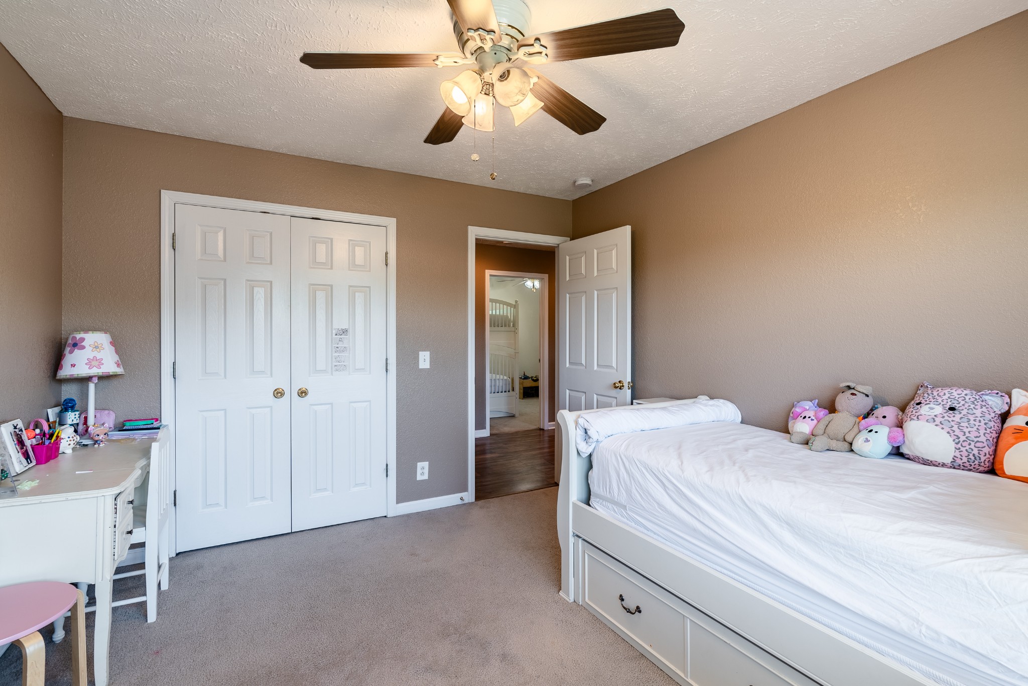 1707 Ginger Way Spring Hill, TN 37174 - Photo 30 of 39 a bedroom with a bed and a chandelier