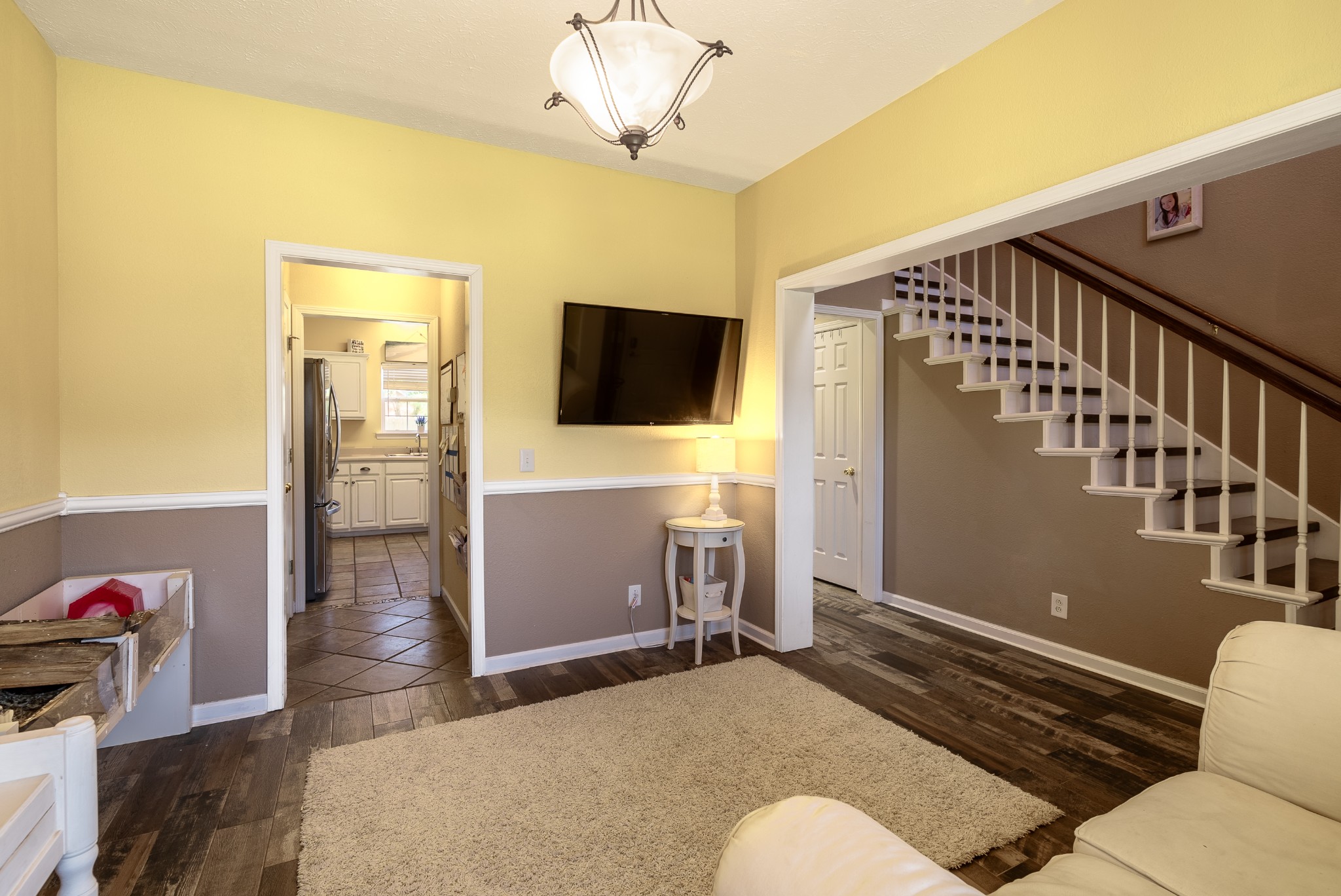 1707 Ginger Way Spring Hill, TN 37174 - Photo 6 of 39 a living room with furniture and a flat screen tv