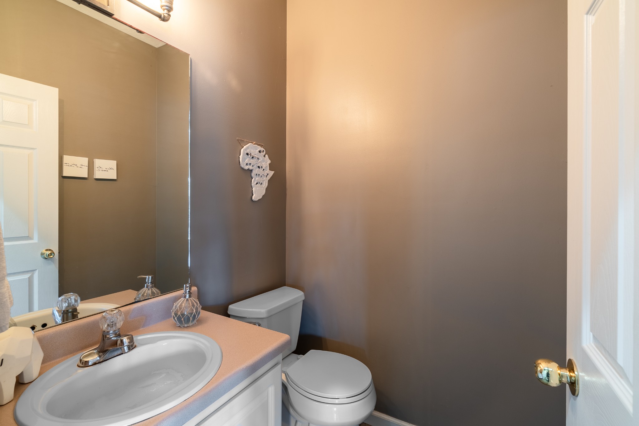 1707 Ginger Way Spring Hill, TN 37174 - Photo 7 of 39 a bathroom with a sink toilet and mirror
