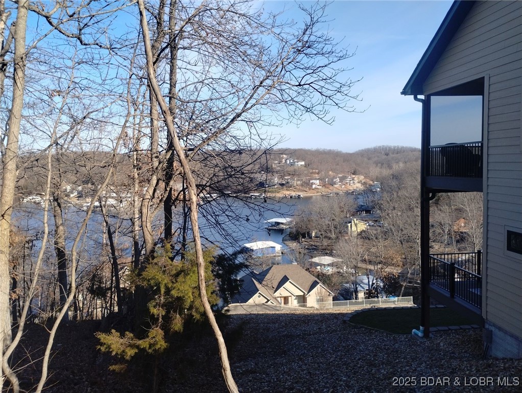 Lot 49 South Beacon Ridge Lake Ozark, MO 65049 - Photo 2 of 28 Lake view from right side of lot near neighbor's h