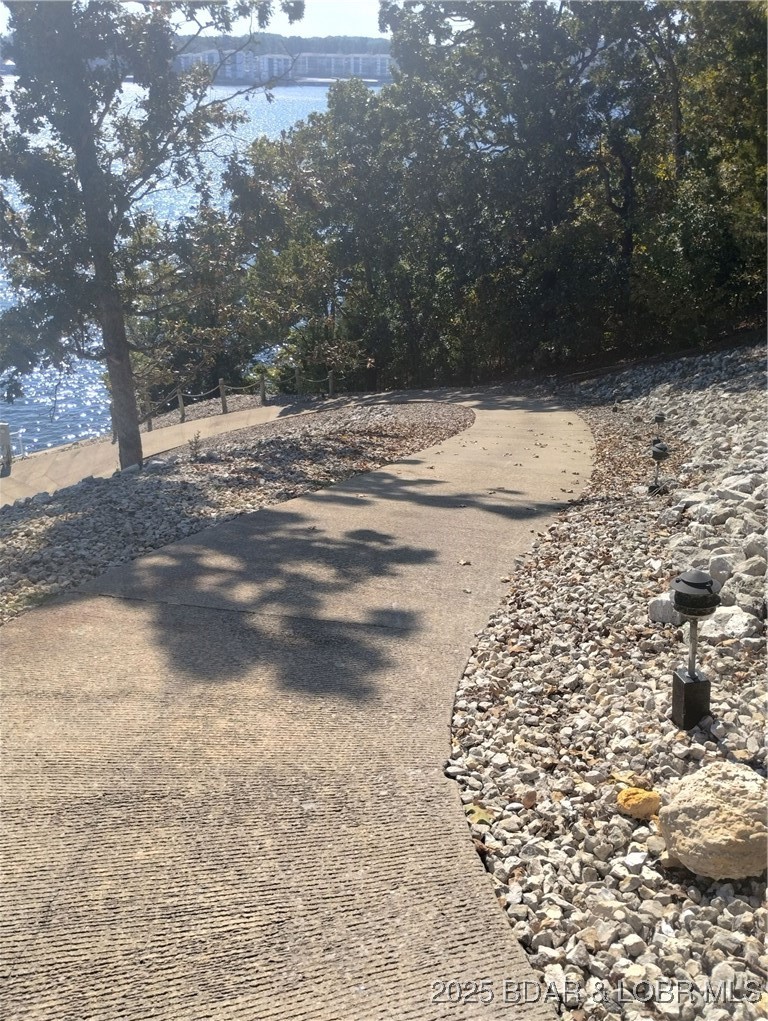 Lot 49 South Beacon Ridge Lake Ozark, MO 65049 - Photo 28 of 28 Golf cart path to community dock