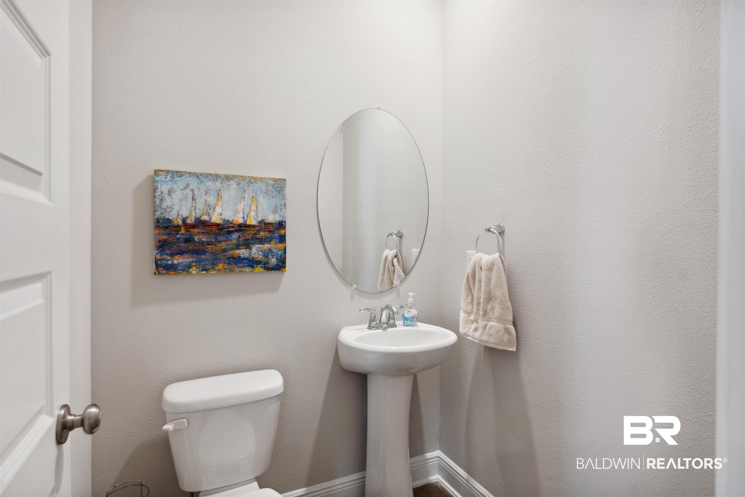 23809 Devonfield Lane Daphne, AL 36526 - Photo 21 of 29 Half bathroom with toilet